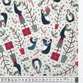 Fabric featuring a Christmas-themed pattern with penguins and holiday decorations.