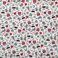 Fabric with a Christmas-themed pattern featuring holiday motifs on a white background.