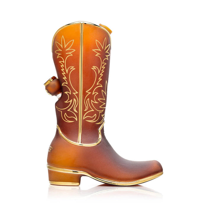 Side profile of 9″ Hemper cowboy boot glass bong showing recessed 14.5 mm joint, tall boot shaft artwork and shiny gold heel and sole trim.