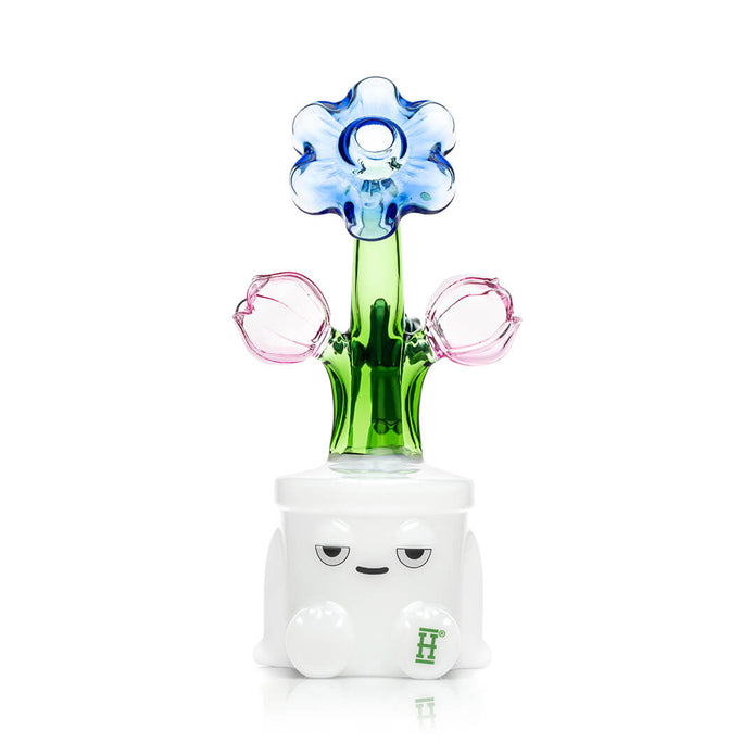 Front view of Hemper Bloom XL bong showing blue flower top, green stem, pink buds, and white character base