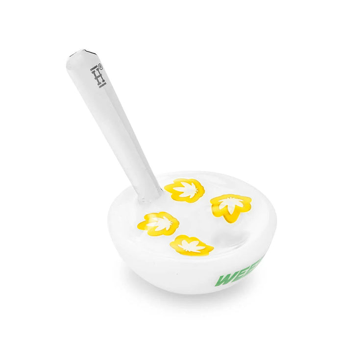 Top view of Hemper cereal bowl hand pipe with yellow leaf-shaped details inside the bowl