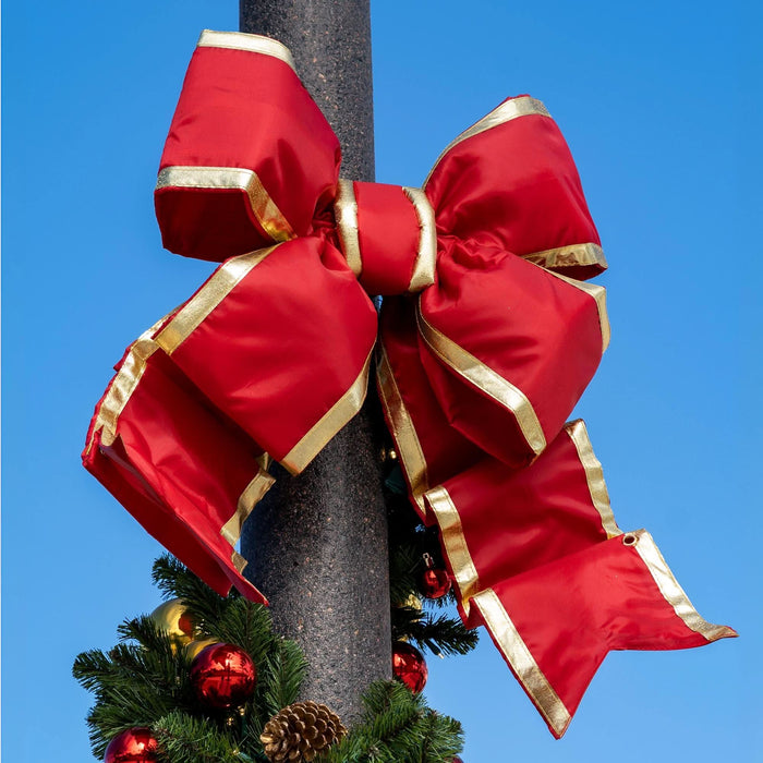 Red Structural Bow with Gold Trim featuring oversized loops, layered tails, and a bright satin finish.